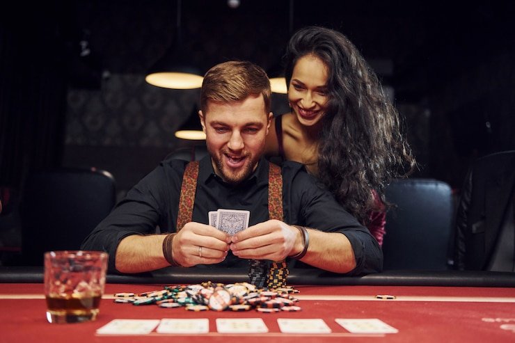 aksara4d group mobile app interface showing live blackjack table and sportsbook menu on smartphone screen